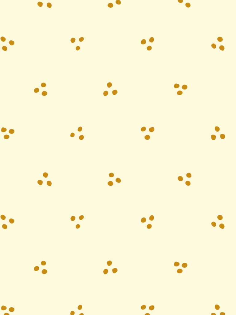 Tiny three-dot clusters scattered in warm ochre across a soft cream ground.